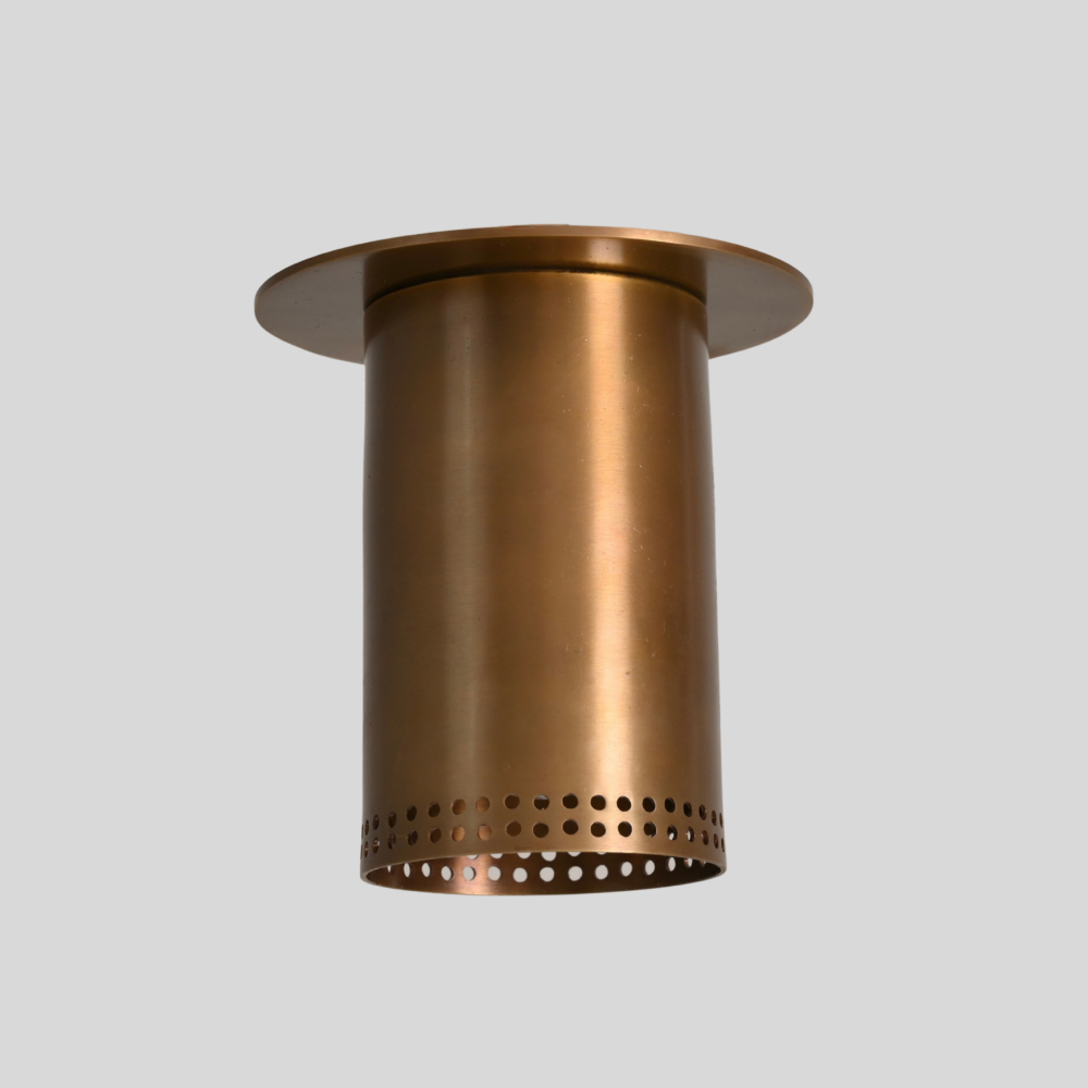 Brass flush mount spotlight with perforated rim, side profile