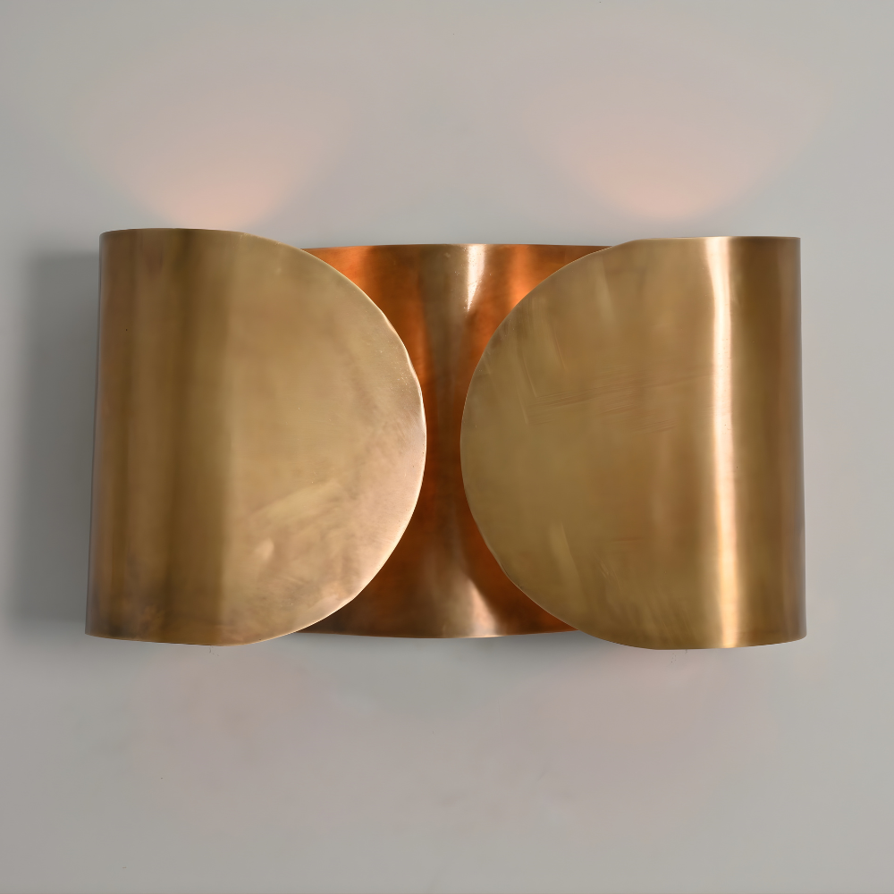 modern butterfly wall light in a warm brass glow handcrafted by LightCove