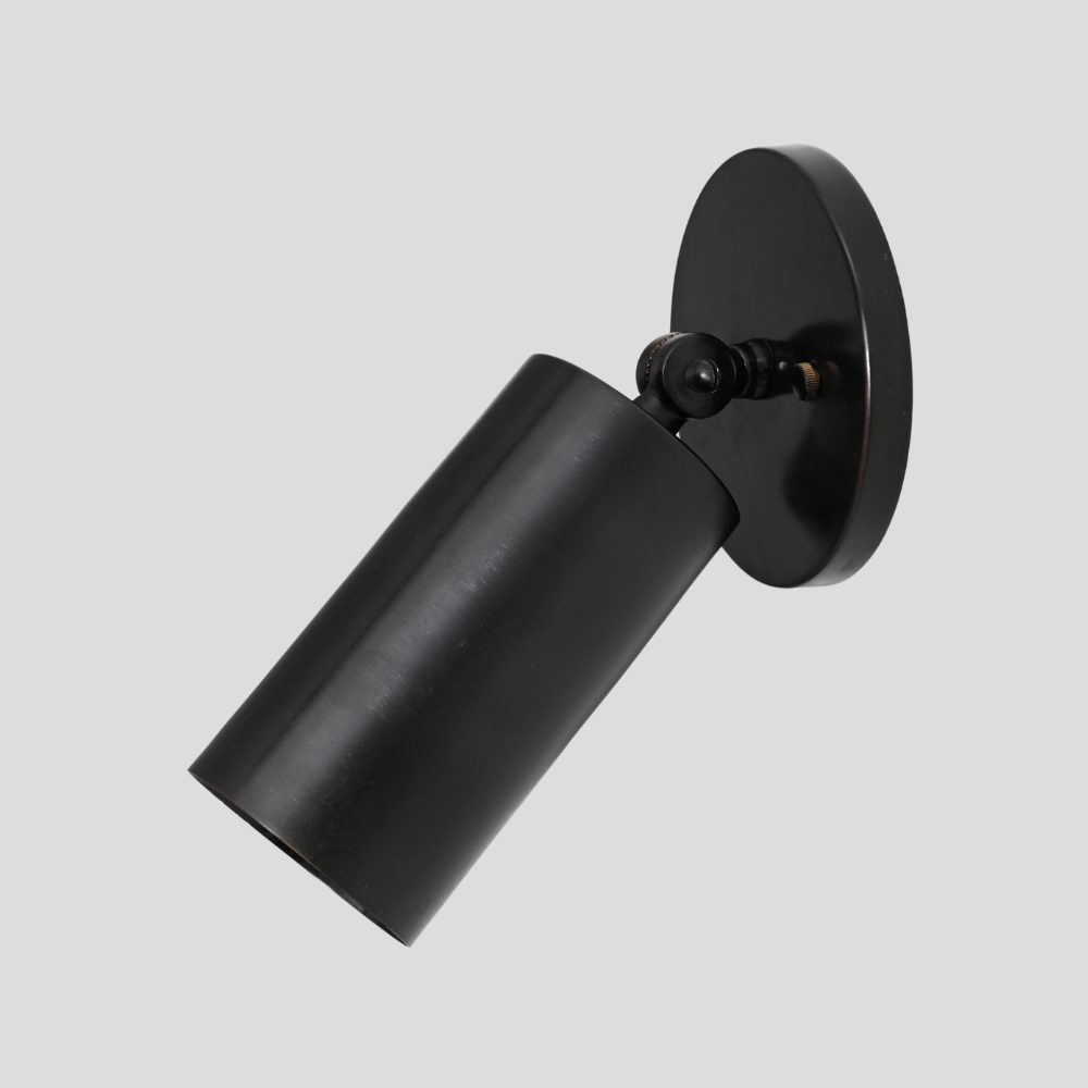 Antique Black spot light wall sconce on a gray background