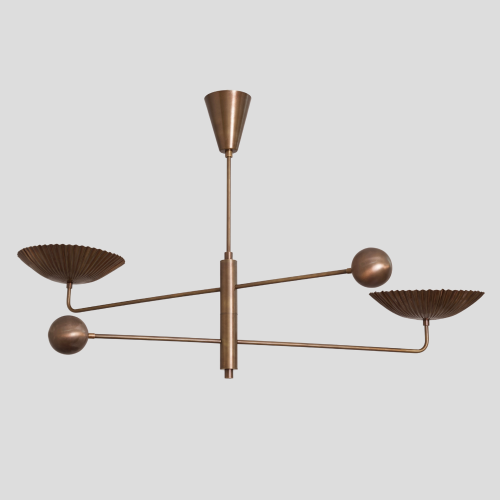 Modern Brass ceiling light with two arms on a light gray background
