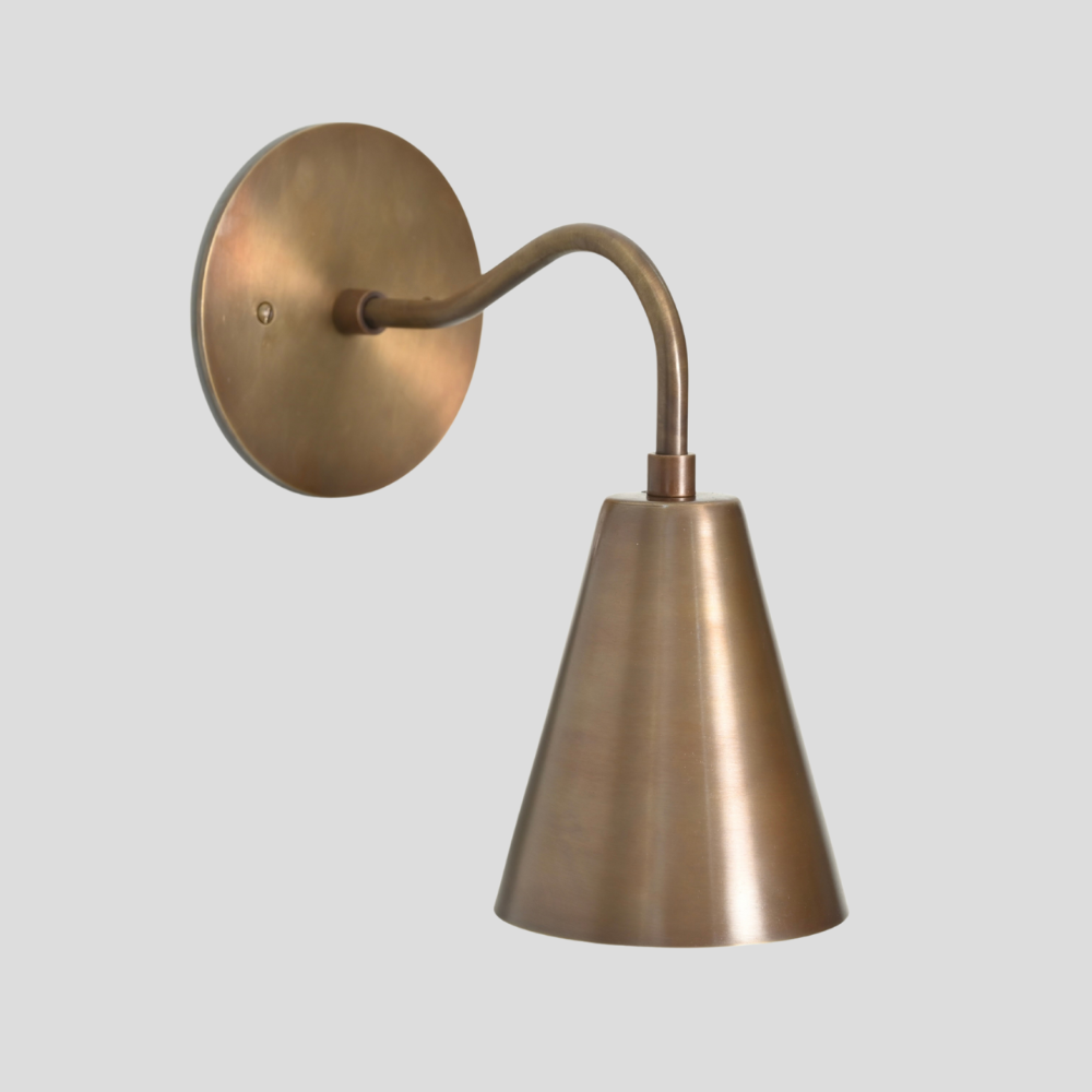 Italian Brass wall lamp on a light gray background