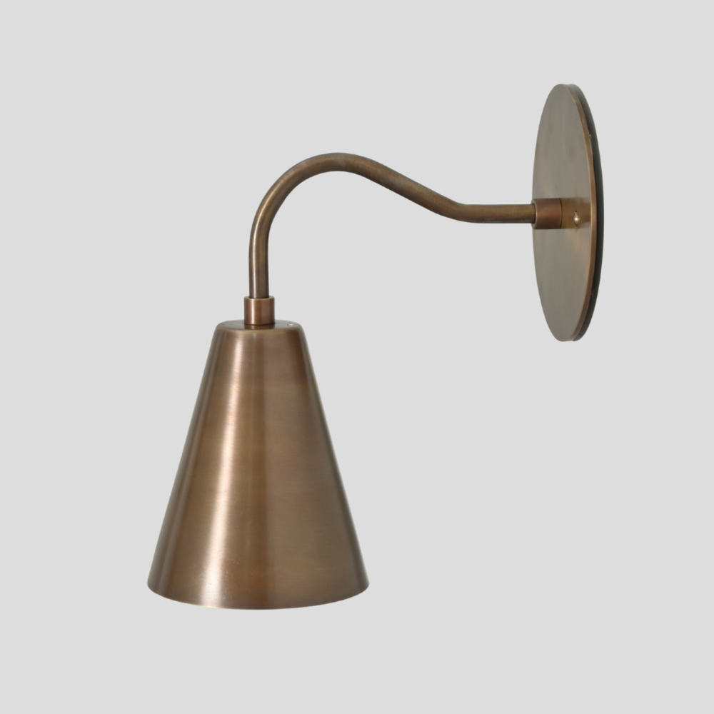 Bronze wall sconce with adjustable arm on a light gray background