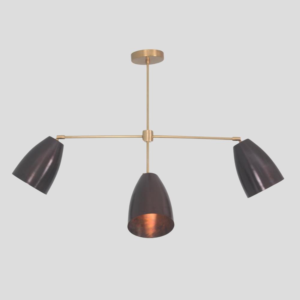 Handmade modern pendant with four matt black lights and a raw brass finish
