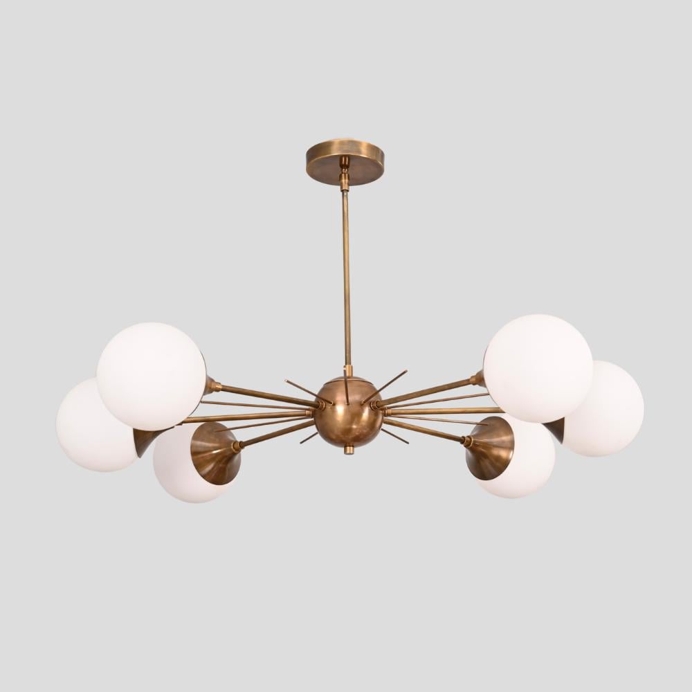 six arm brass globe sputnik chandelier on a gray background designed by LightCove