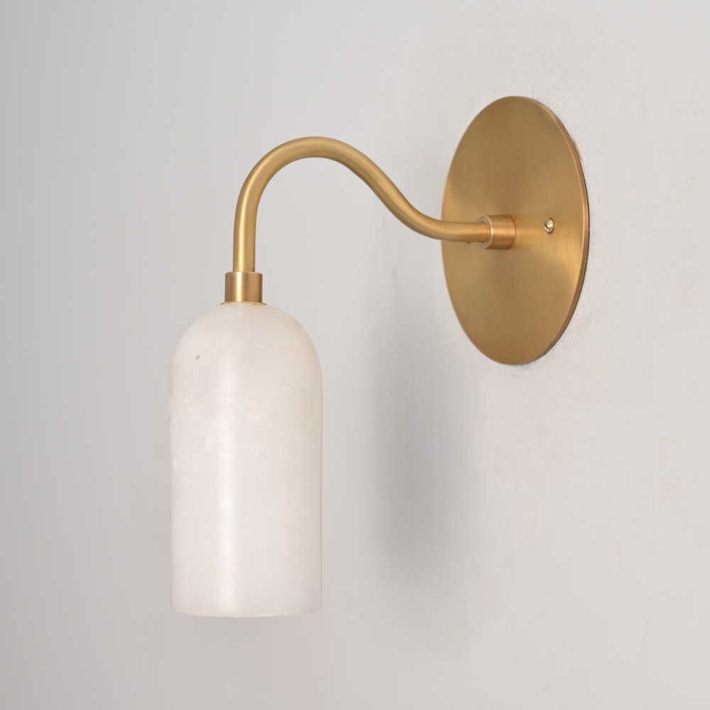 Handmade brass wall lamp with curved arm and alabaster shade