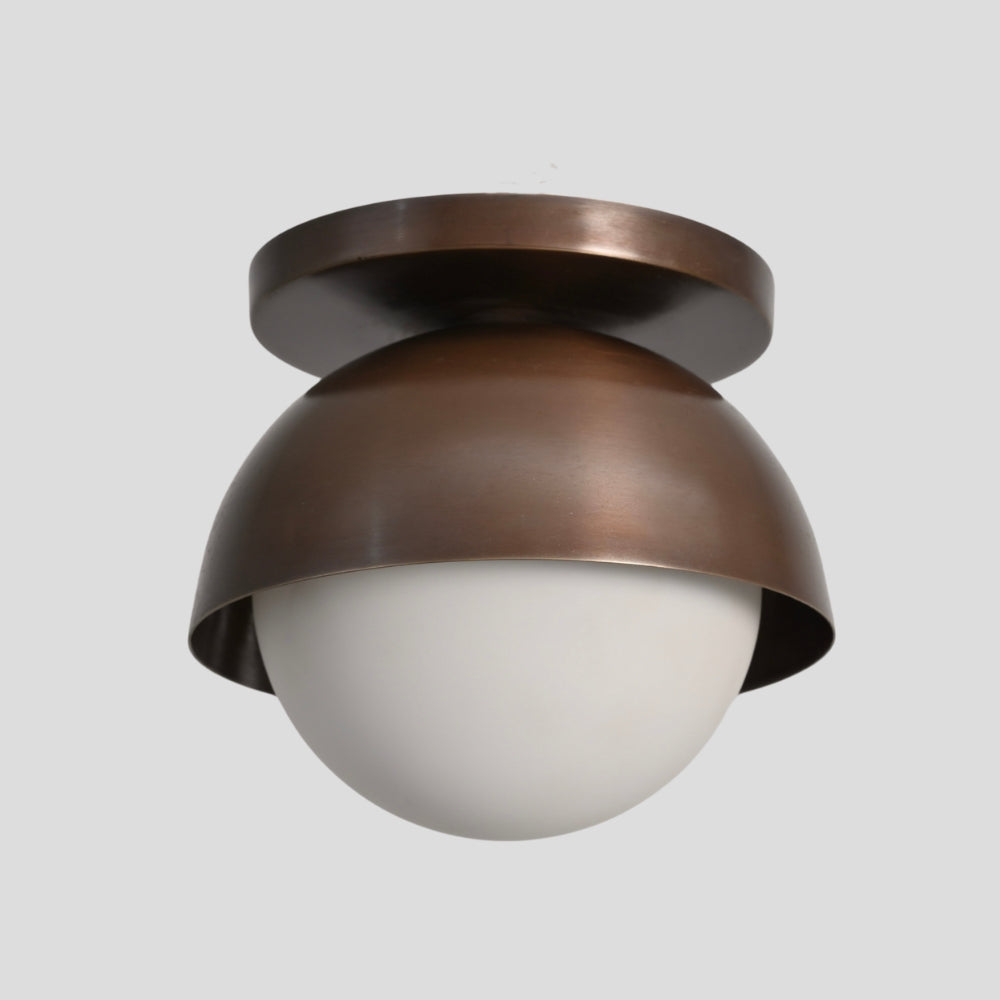 minimalist brass ceiling light with round opal glass globe