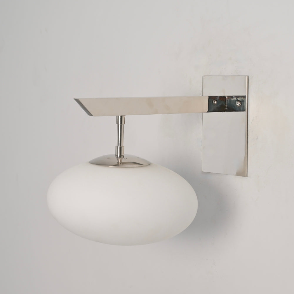 Mid century brass milky globe designed with a handcrafted polished chrome horizontal rod by LightCove