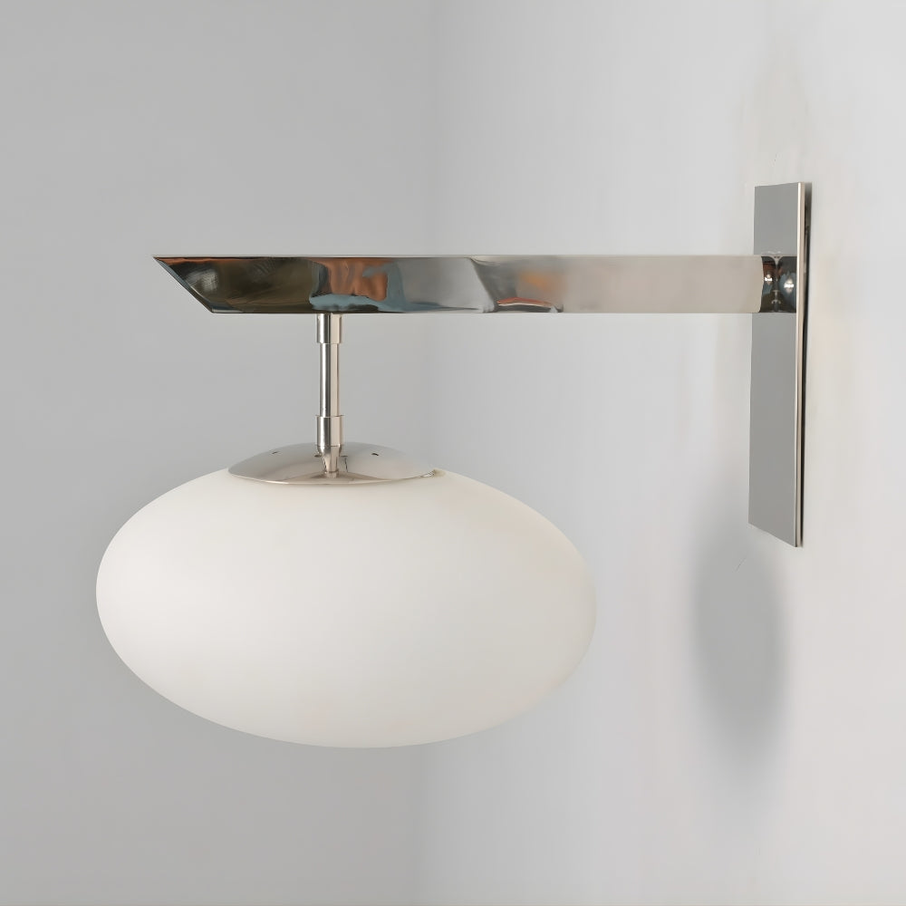 Wall mounted light fixture with a white glass shade and polished chrome finish on a gray background