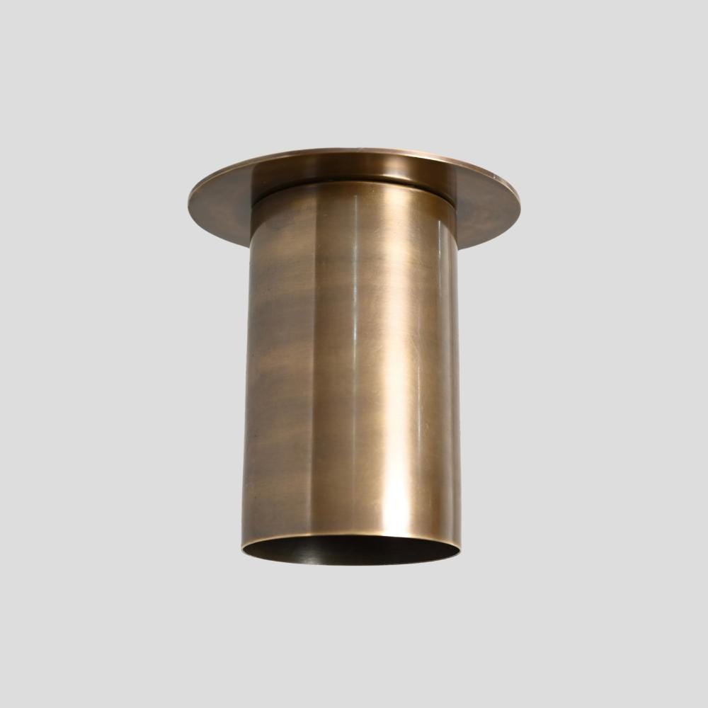 Minimalist ceiling spot light designed in an antique brass finish