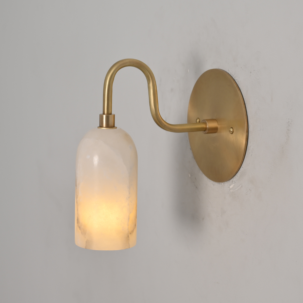 Handmade alabaster wall sconce in raw brass finish