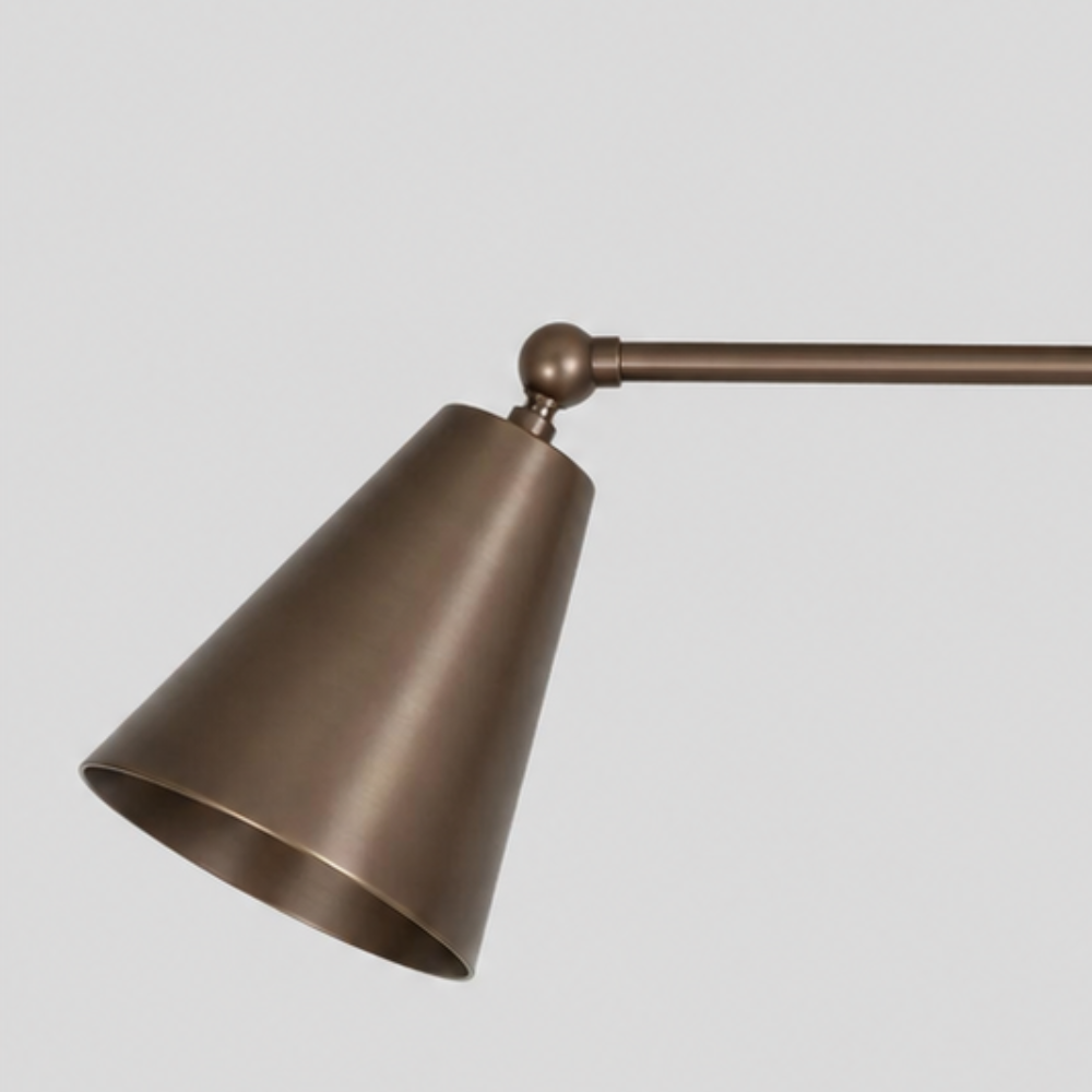 Close-up detail view of Double Brass Cone Shade Flush Mount - Adjustable Ceiling Light showing angled shade, brass connecting arm with spherical finial, and circular canopy.