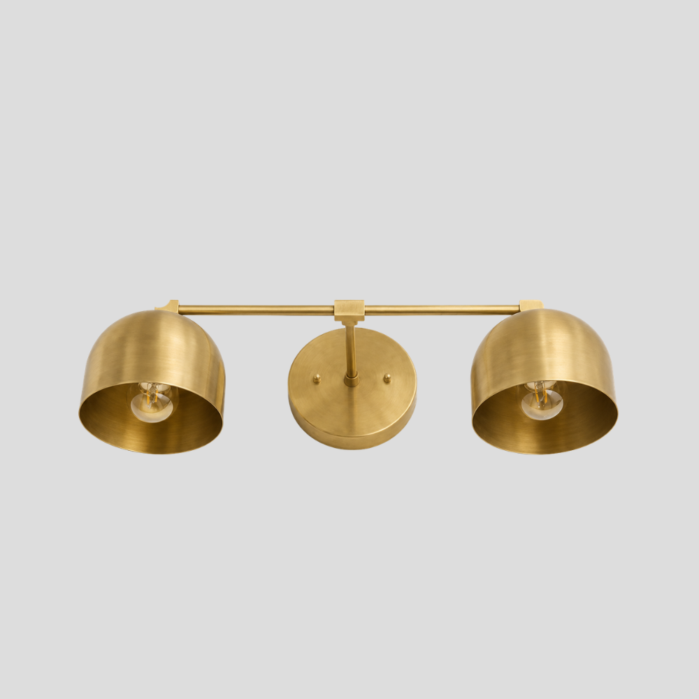 Double Brass Dome Vanity Light - Mid Century Linear Wall Sconce featuring a handmade vanity light with a mid-century linear wall sconce design and two brass shades.