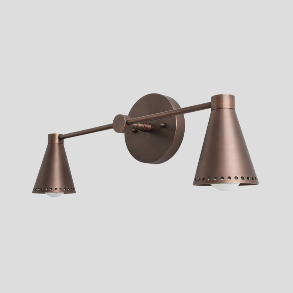 Double Perforated Brass Cone Sconce - Mid Century Vanity Light with horizontal bar arm, dual perforated cone shades, and round wall mount base.