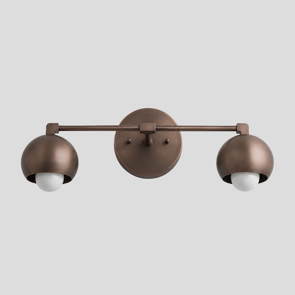 Double Rounded Brass Dome Vanity Light - Mid Century Globe Wall Sconce with horizontal bar arm, dual dome shades, and round wall mount base.