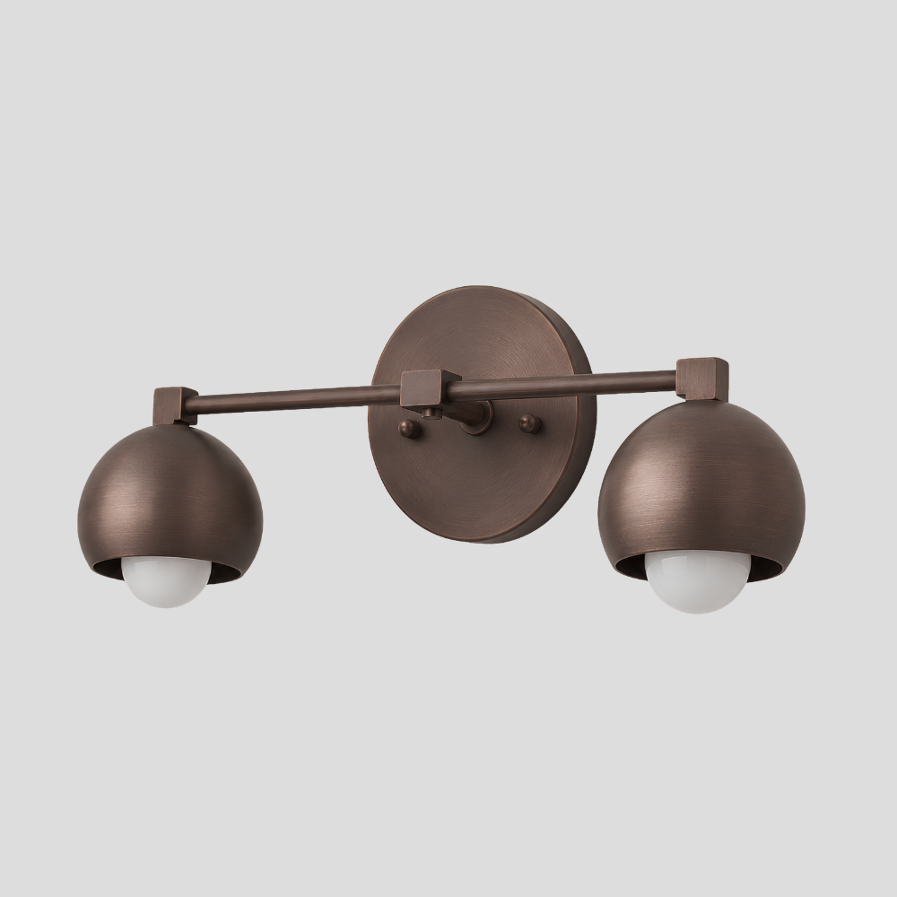 Double Rounded Brass Dome Vanity Light - Mid Century Globe Wall Sconce with horizontal bar arm, dual dome shades, and round wall mount base.