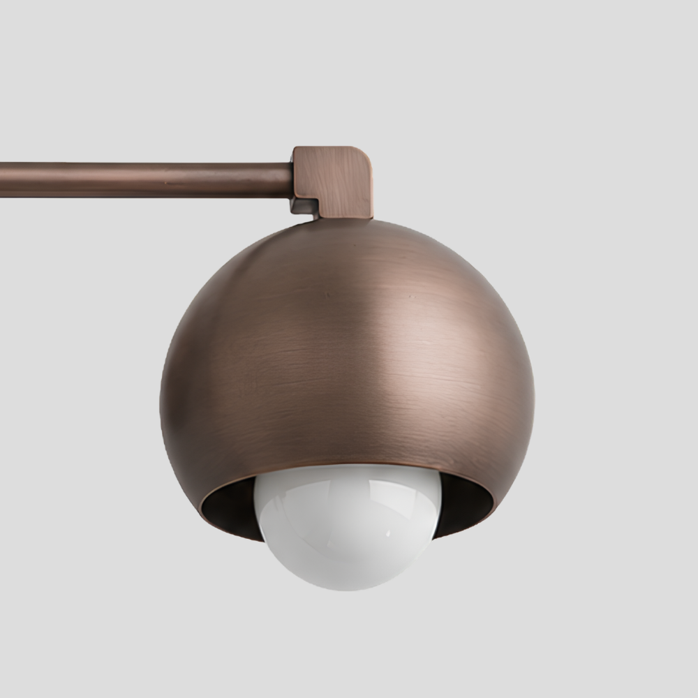 Close-up of Double Rounded Brass Dome Vanity Light - Mid Century Globe Wall Sconce showing dome shade, globe bulb, and arm joint detail.