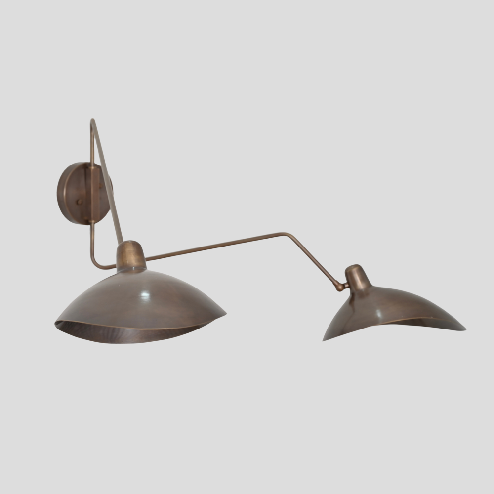 Vintage-style wall lamp with two adjustable arms on a light gray background