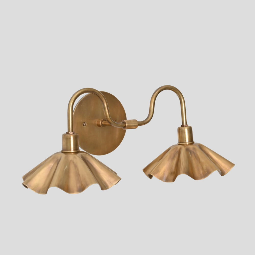 floral inspired brass wall light for interior spaces