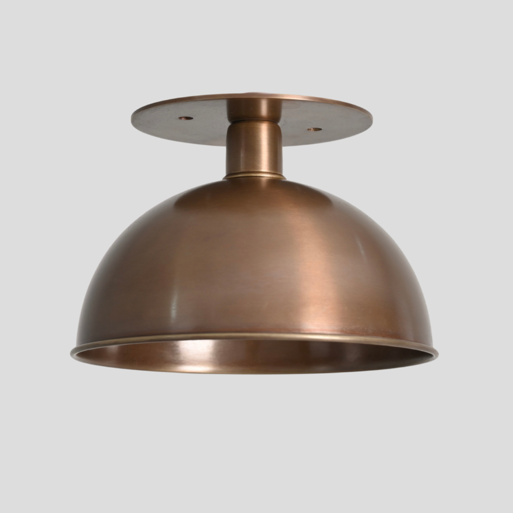 Mid century semi flush mount on a gray background handcrafted with a pure antique brass finish by LightCove