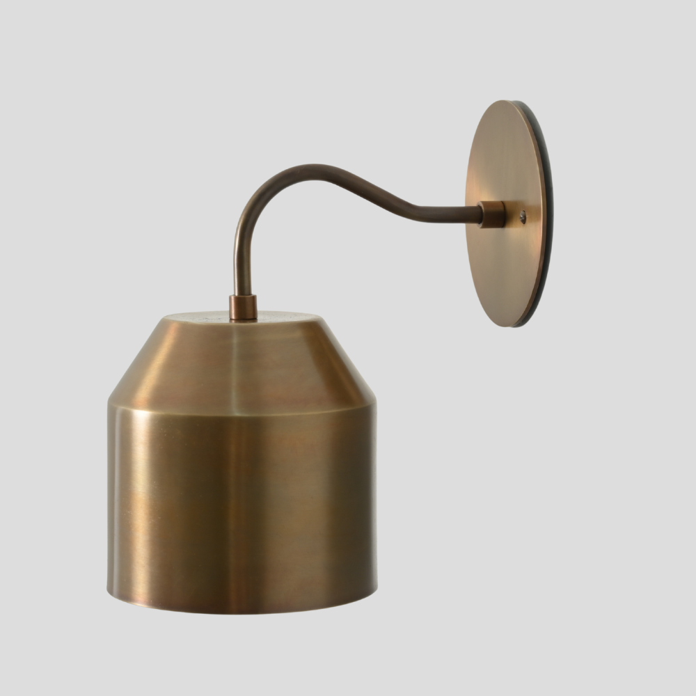Minimalist pure brass handcrafted wall lamp in a mid century design