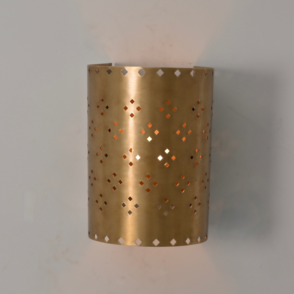 Handmade brass wall lamp with geometric perforated pattern