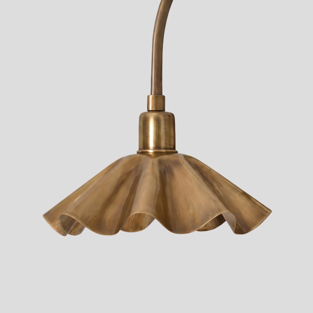 Close-up of Modern Brass Ruffled Petal Shade Wall Lamp - Curved Flower Gooseneck Sconce showing petal shade ruffles and arm curve