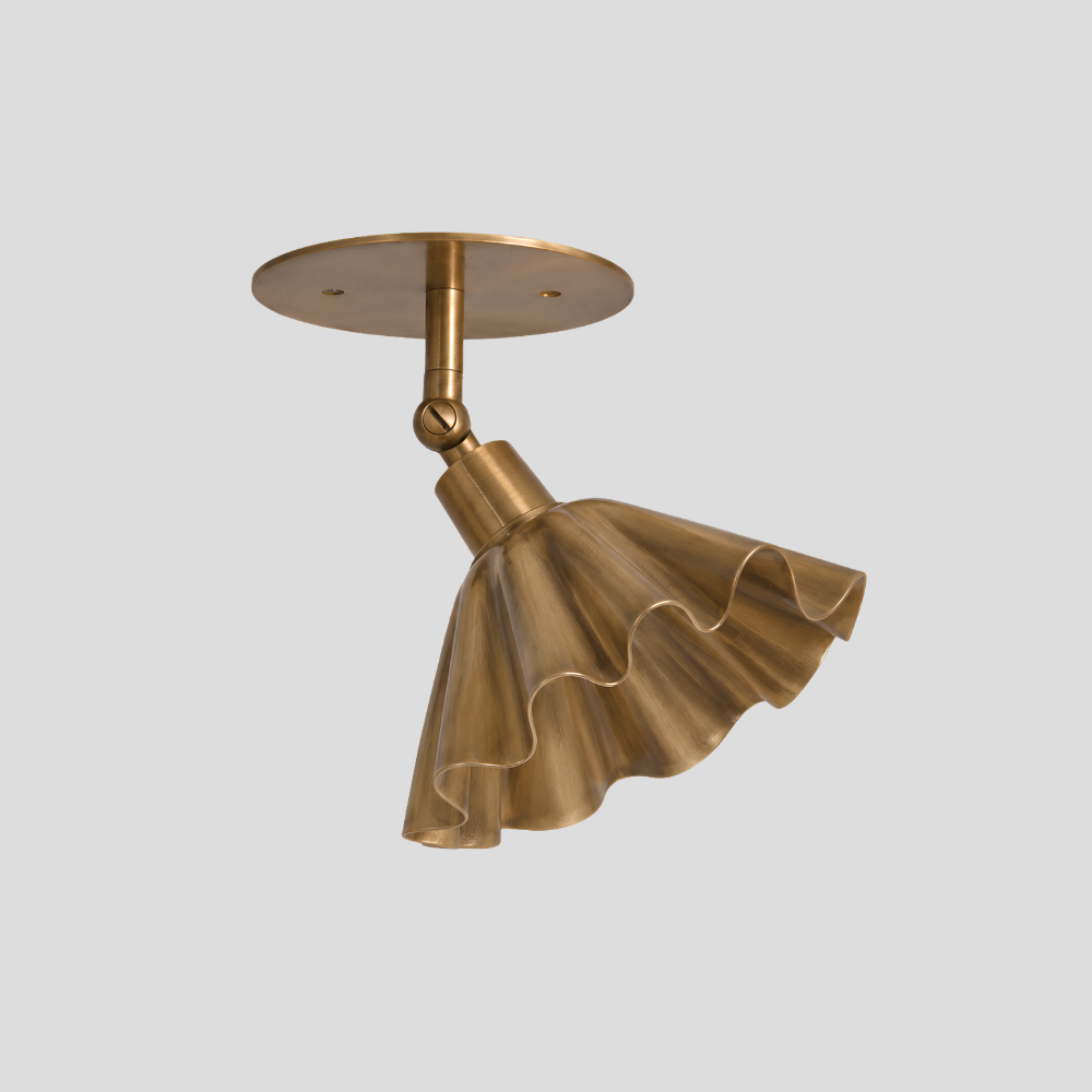 Ruffled Brass Flower Spot Light - Adjustable Ceiling Light with sculptural fluted trumpet shade, articulating brass arm, swivel joint connector, and circular brass ceiling canopy.