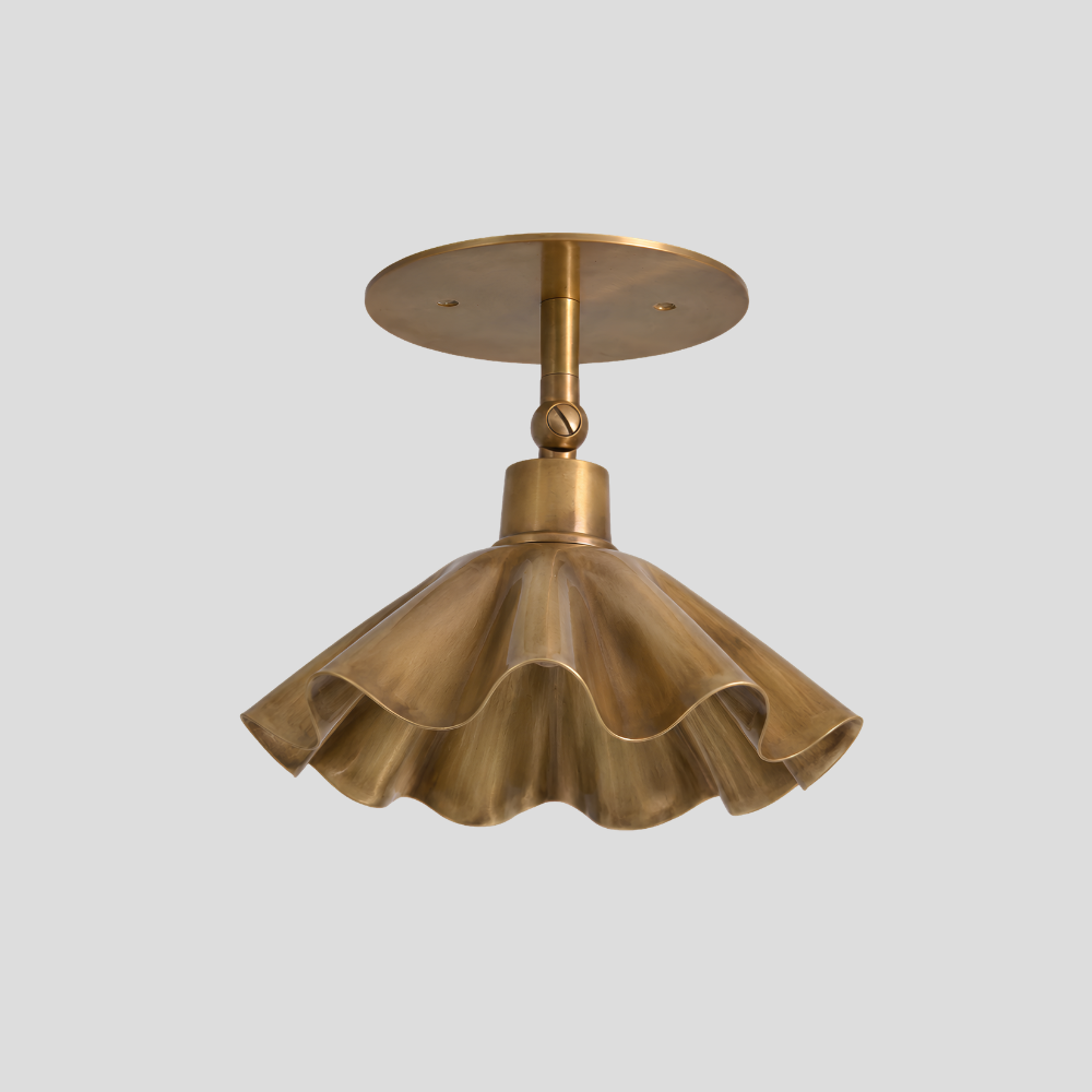 Ruffled Brass Flower Spot Light - Adjustable Ceiling Light with sculptural fluted trumpet shade, articulating brass arm, swivel joint connector, and circular brass ceiling canopy.