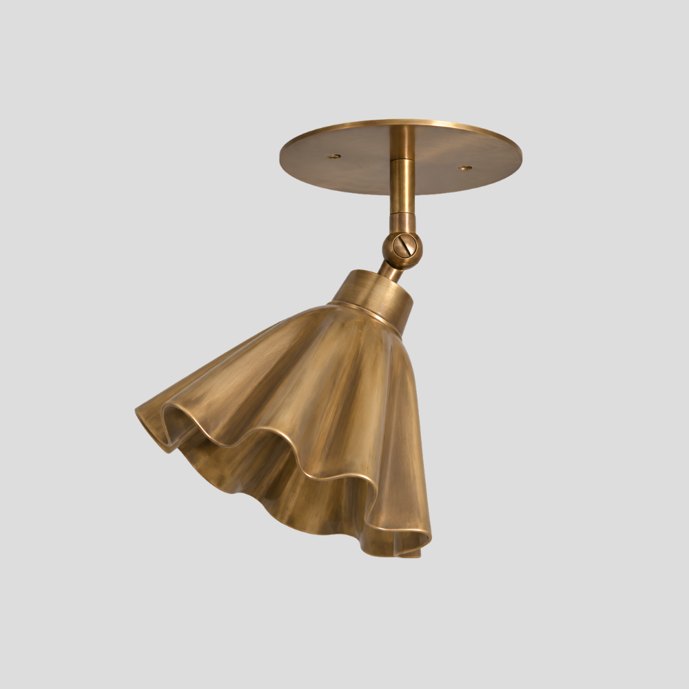 Ruffled Brass Flower Spot Light - Adjustable Ceiling Light with sculptural fluted trumpet shade, articulating brass arm, swivel joint connector, and circular brass ceiling canopy.