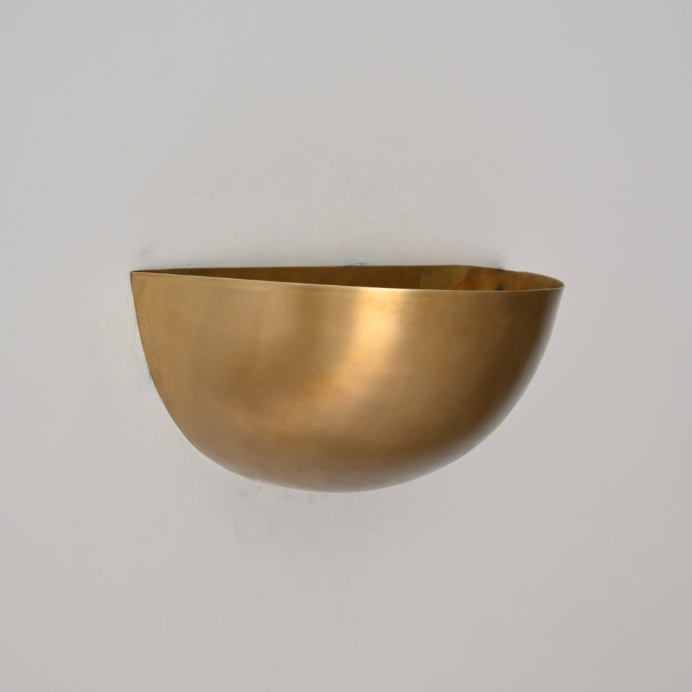 Modern mid century brass wall lamp designed with modern cut shade