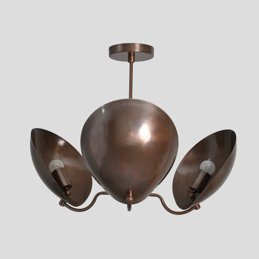 modern brass three light ceiling light on a gray background
