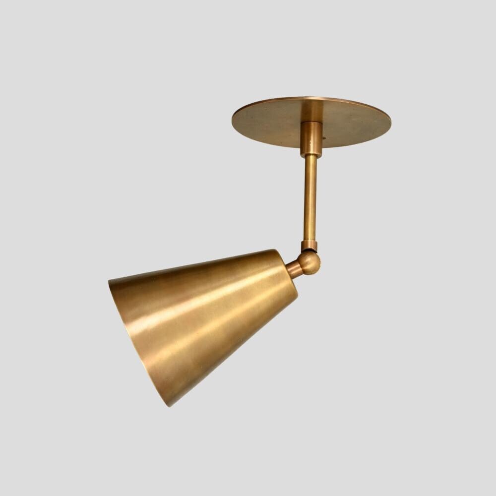 1950s brass wall lamp with adjustable arm and raw brass finish 