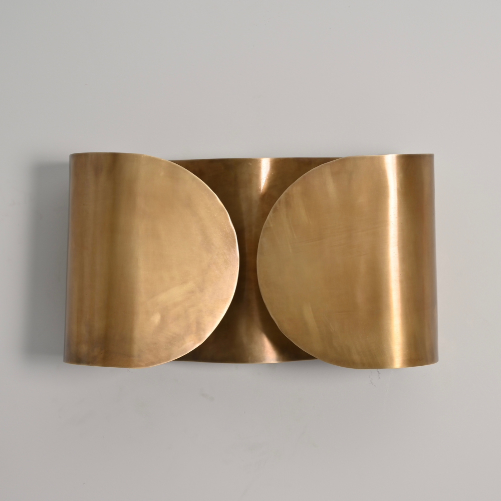 Butterfly wall sconce handcrafted with premium metal on a gray wall 