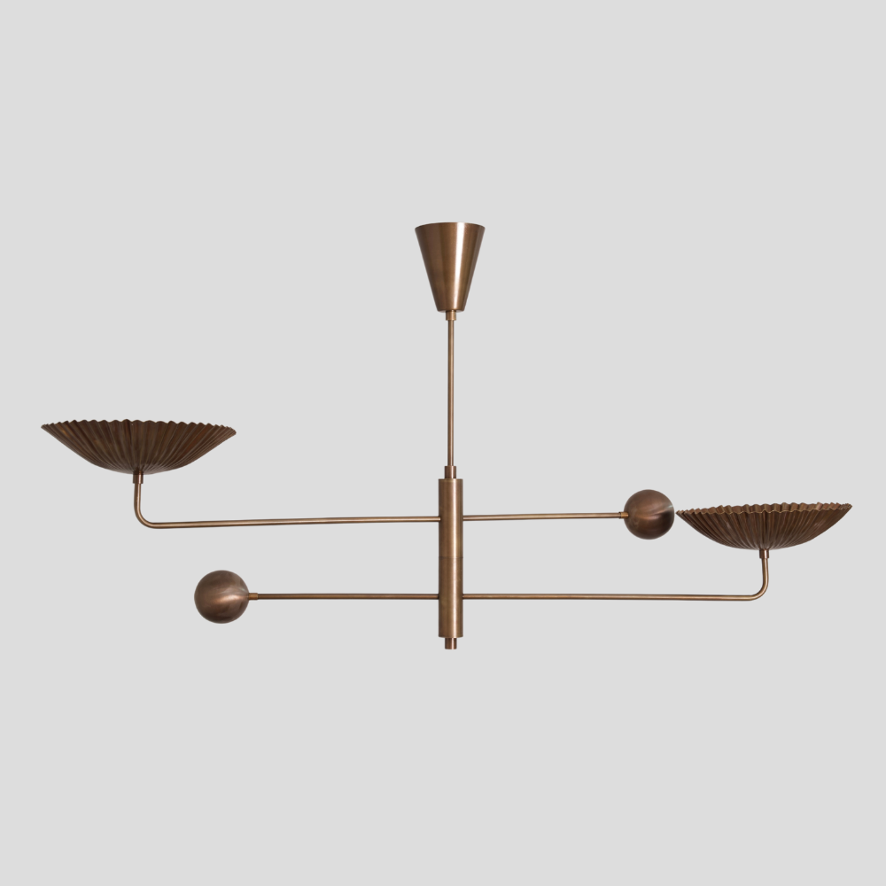 Mid century pure brass sputnik chandelier with two arms on a light gray background