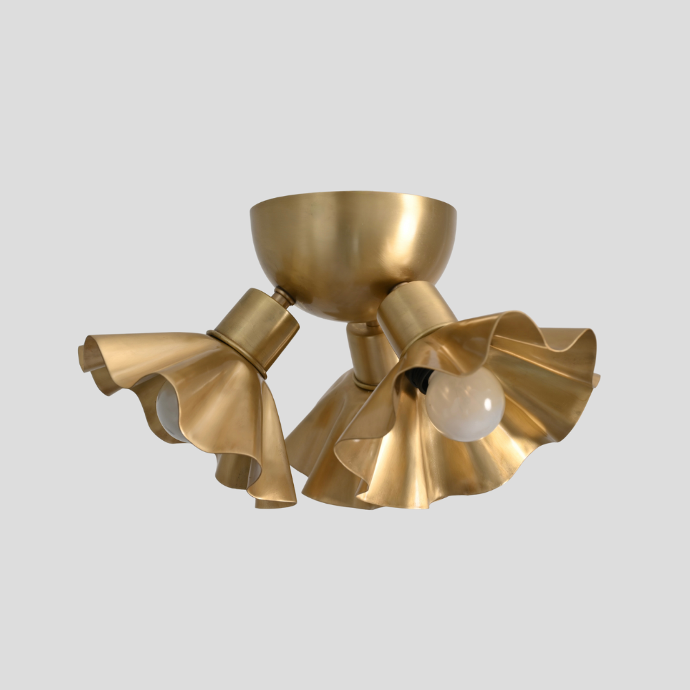Gold ceiling light fixture on a gray background