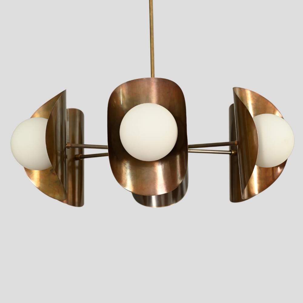 Modern mid century 6 light ceiling light designed with a pure antique brass finish 