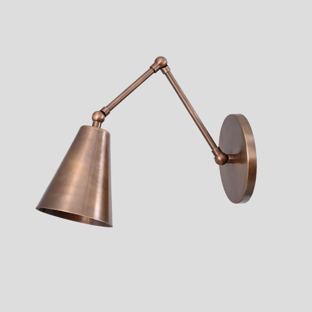 a vintage articulated brass lamp, designed for entryways and hallways
