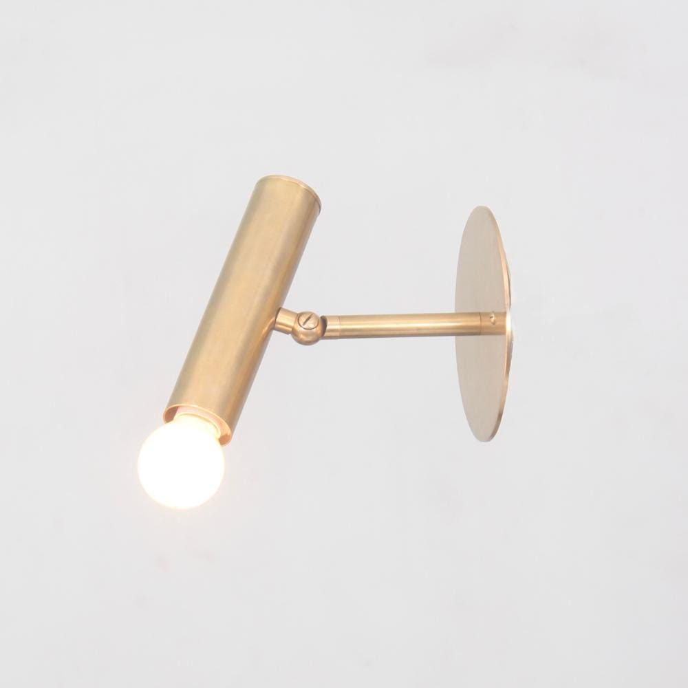 Minimalistic cylinder brass wall sconce, adjustable lamp in a mid century design