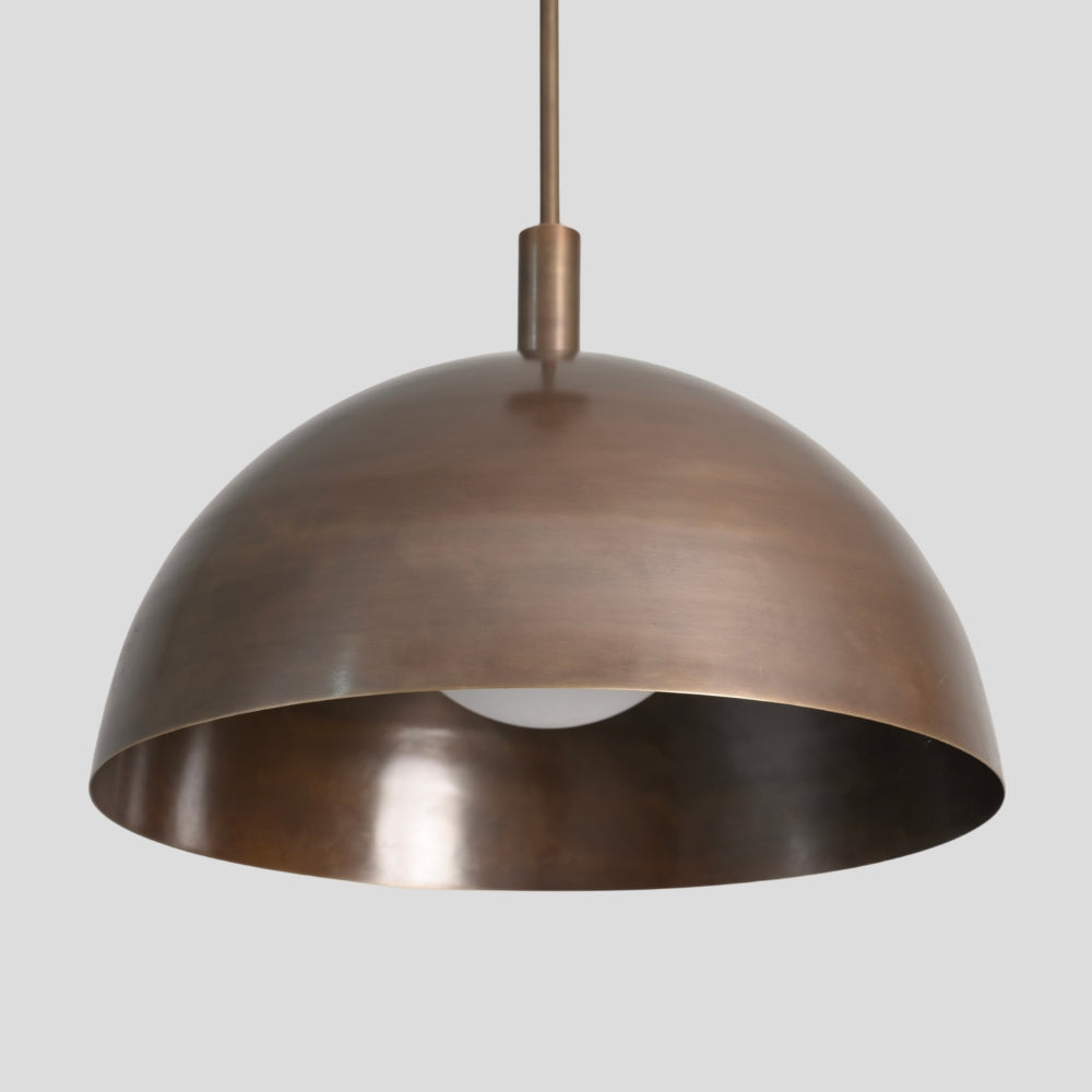 close up on the brass dome shade pendant light for kitchen dining mid century design