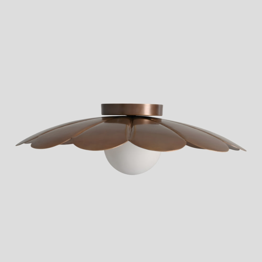 sculptural brass petal ceiling light with glass globe