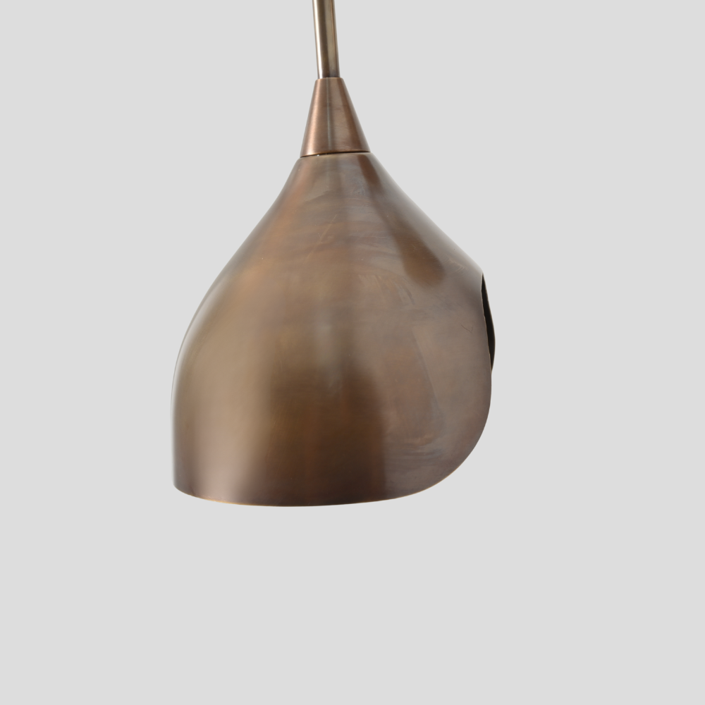 Brass wall sconce on a gray background