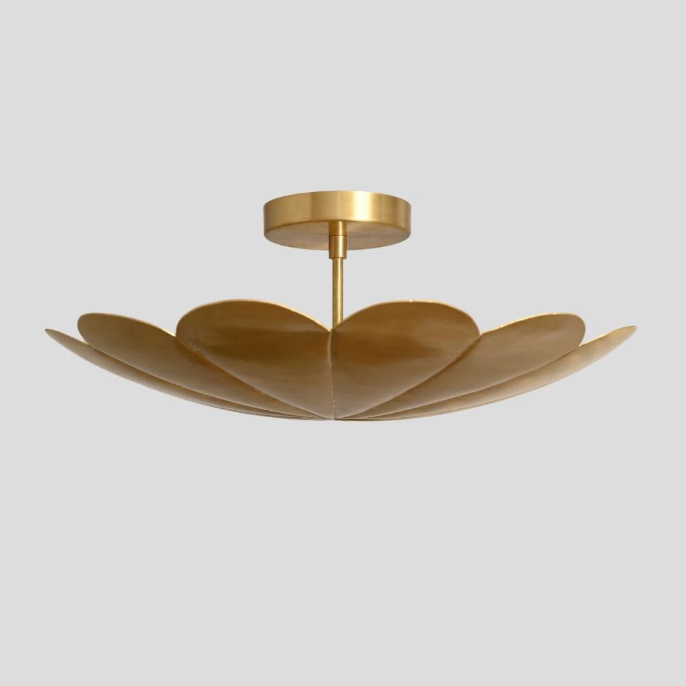 Modern brass semi flush mount with a flower shade 