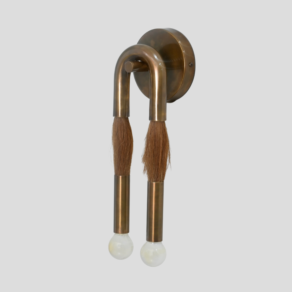 brass tube wall sconce with a double frosted glass globe handcrafted in a 1950s design 
