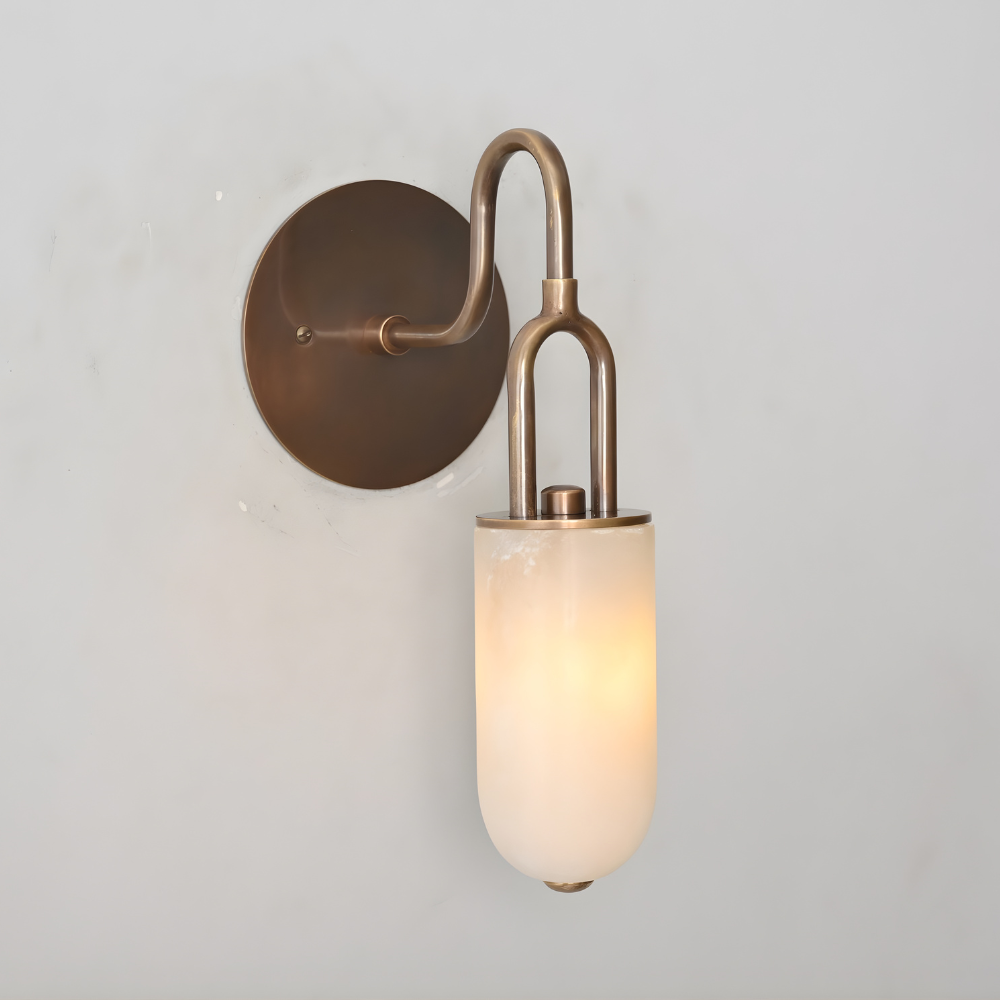 Mid century brass and alabaster wall lamp with curved arm