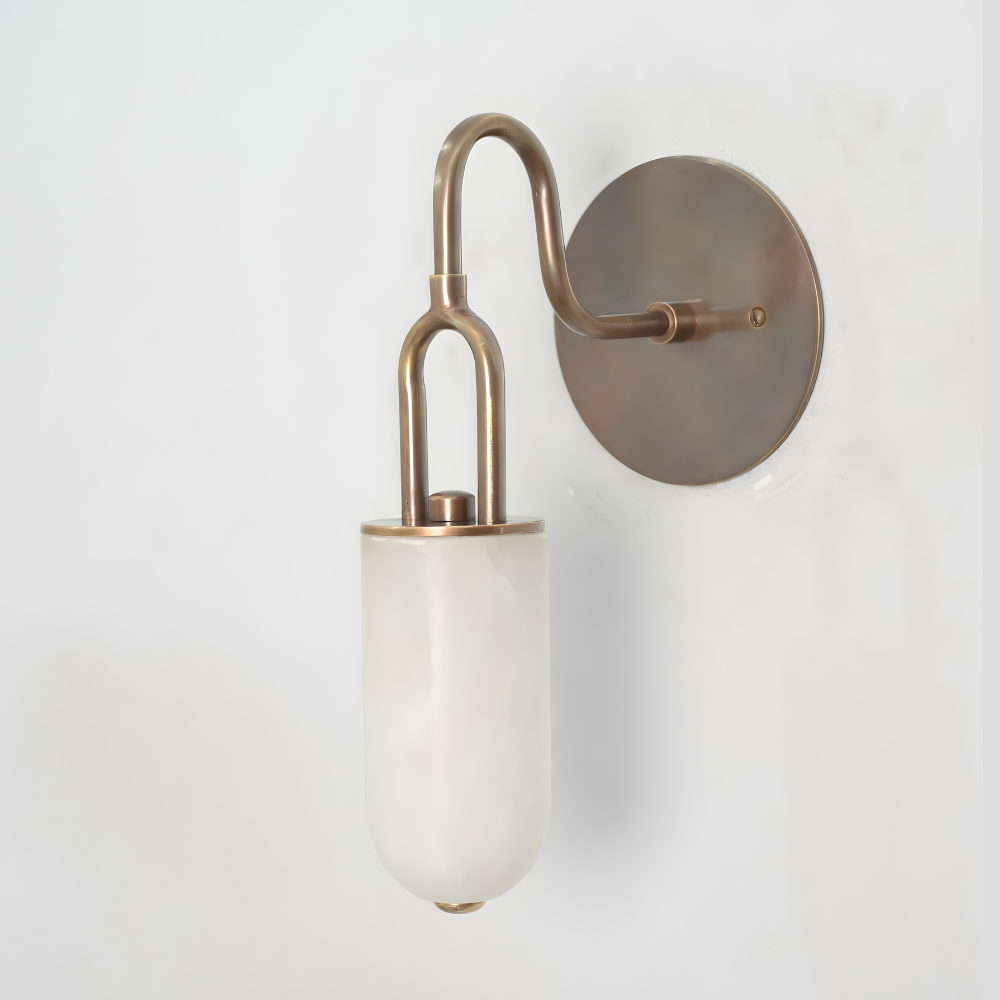 Curved brass wall light inspired by mid century modern design