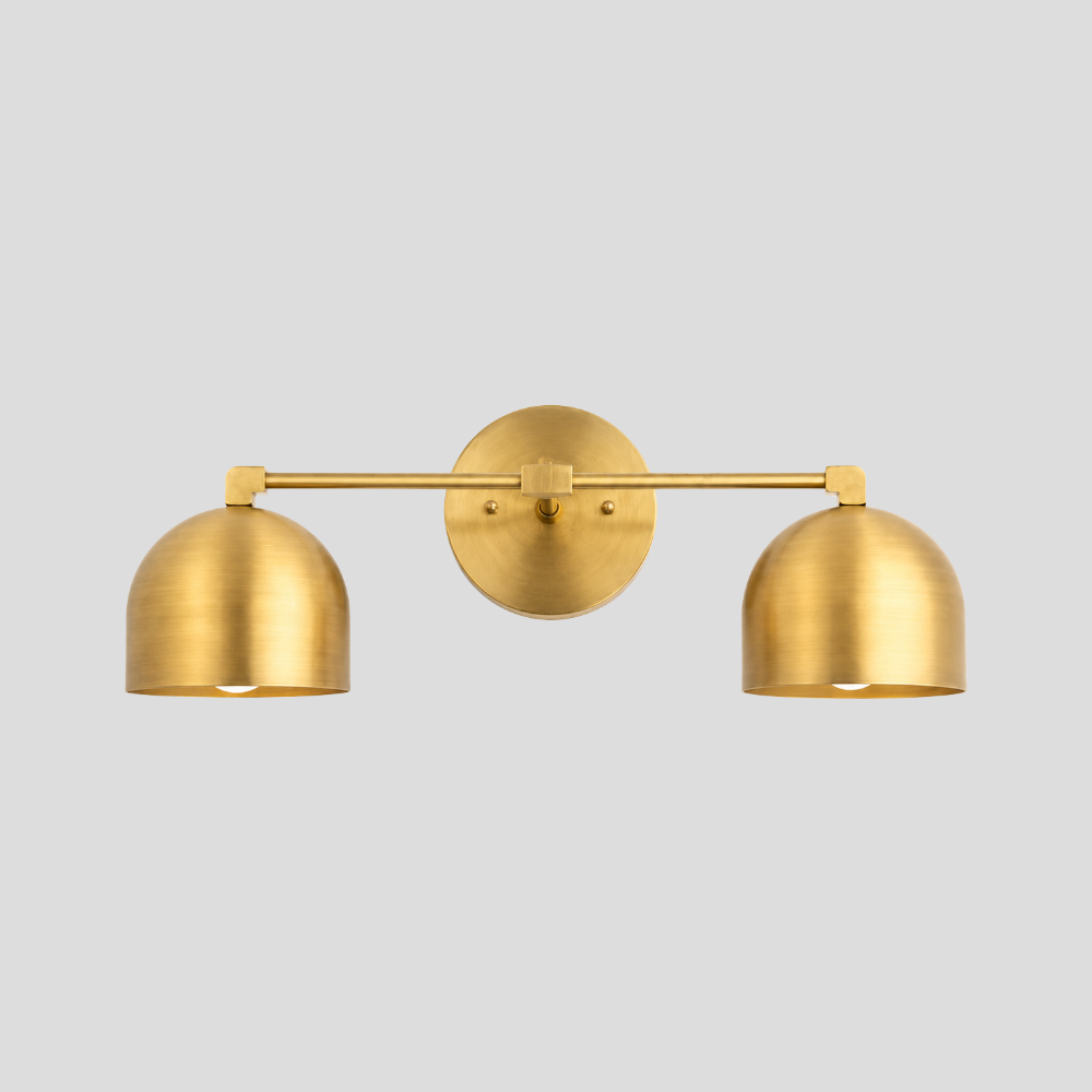 Double Brass Dome Vanity Light - Mid Century Linear Wall Sconce featuring a handmade vanity light with a mid-century linear wall sconce design and two brass shades.