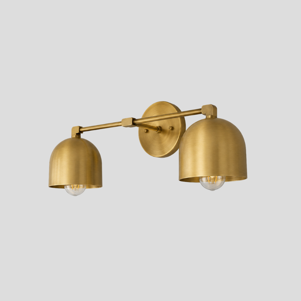 Double Brass Dome Vanity Light - Mid Century Linear Wall Sconce featuring a handmade vanity light with a mid-century linear wall sconce design and two brass shades.