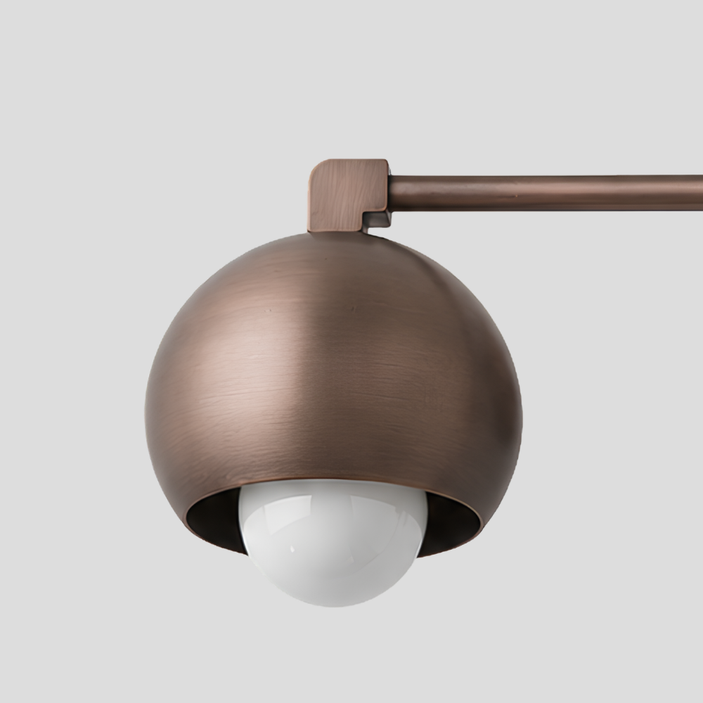 Close-up of Double Rounded Brass Dome Vanity Light - Mid Century Globe Wall Sconce showing dome shade, globe bulb, and arm joint detail