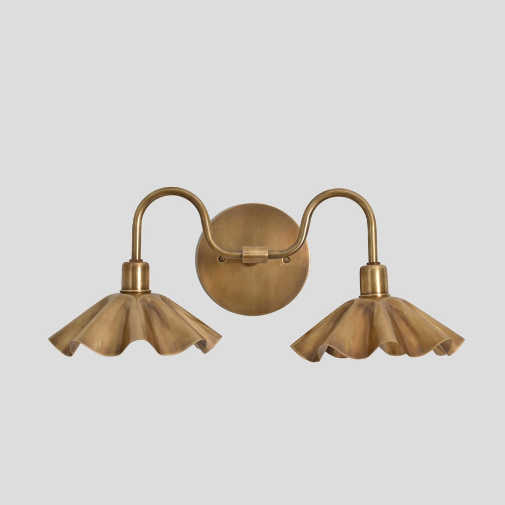 double brass petal wall sconce mounted on wall