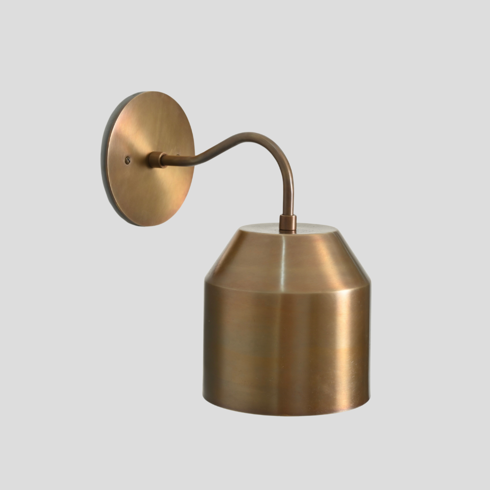 Mid century minimalist brass curved wall lamp in a vintage design. 